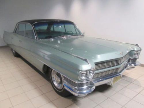 This used green 1964 cadillac deville