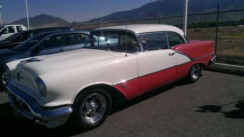2 door hardtop, white and coral, very good cond. orig 324 v-8, 34,000 miles