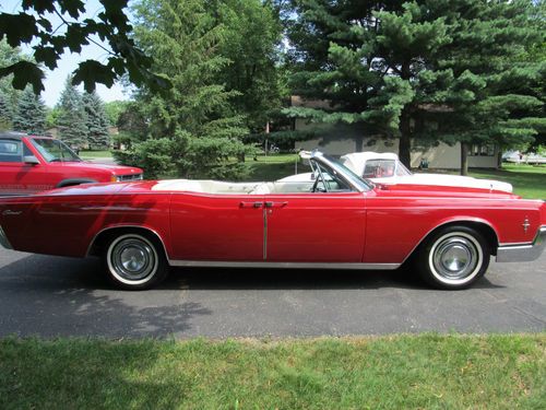 Red convertible with white top and white leather interior